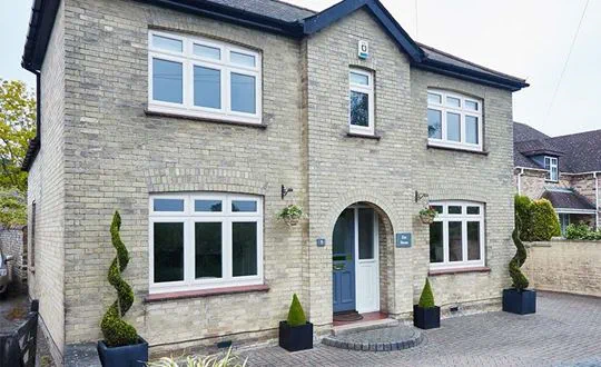 Zoomed view of whole house replacement double glazed UPVC casement windows in Cream from the Anglian double glazing range