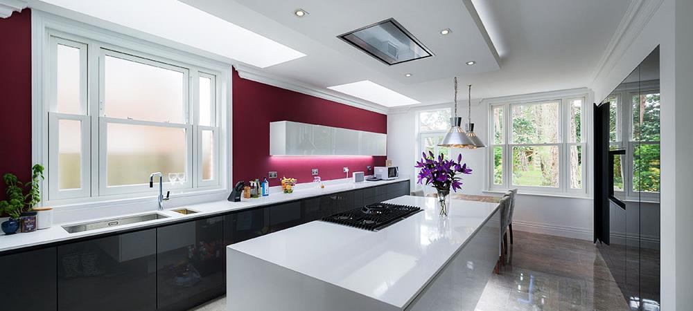 Contemporary kitchen with White UPVC sash windows that vertically slide from the Anglian sash window range