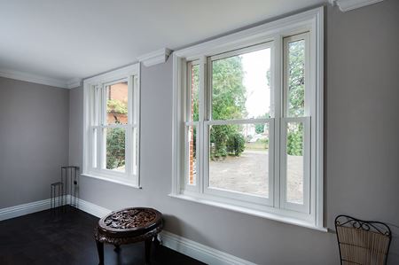 Elite vertical sliding sash windows in White Knight uPVC