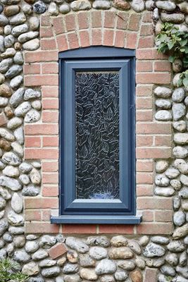 Anthracite Grey UPVC casement double glazed window with Autumn decorative glass pattern from the Anglian double glazing range
