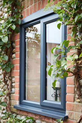Side view of UPVC double glazed casement window finished in dual Anthracite Grey and White from the Anglian windows range