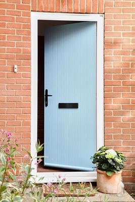 Duck Egg Blue composite front door in cottage style with black handle and letterbox brick house