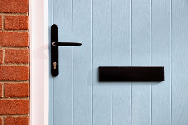 Close up of cottage composite door in Duck Egg Blue with black handle and letterplate from the Anglian front doors range