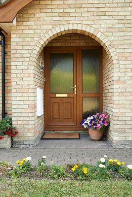 Half glazed UPVC front door with obscure glass finished in Golden Oak from the Anglian UPVC doors range