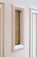 Close up of glass on wooden front door finished in White from the Anglian Georgian front door range