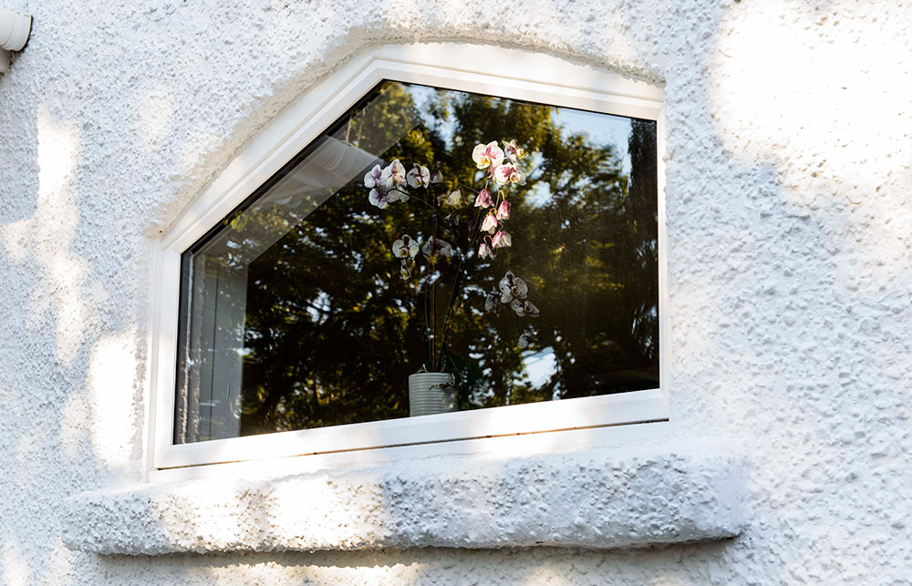 Shaped uPVC casement window in White from the Anglian uPVC casement window range