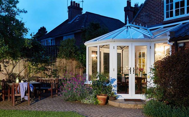 White Knight UPVC Victorian lean to conservatory with period roof finials and UPVC French doors from the Anglian conservatory range