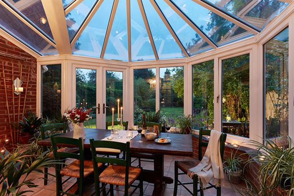 White Knight uPVC lean to Victorian conservatory dining room with large casement windows from the Anglian conservatory range