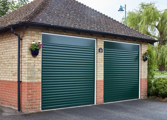 Pair of single fir green traditional aluminium roller garage doors from the Anglian roller door range