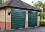 Pair of single fir green traditional aluminium roller garage doors from the Anglian roller door range