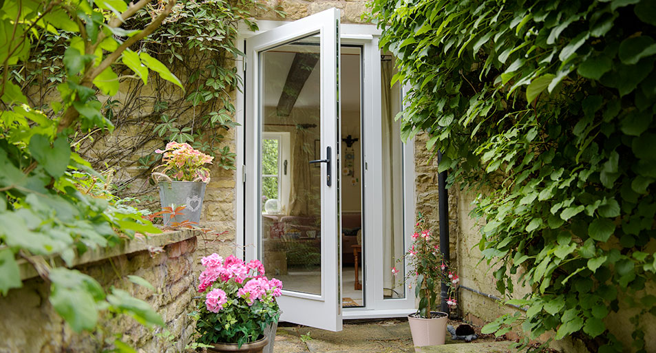 White wooden French door in open position