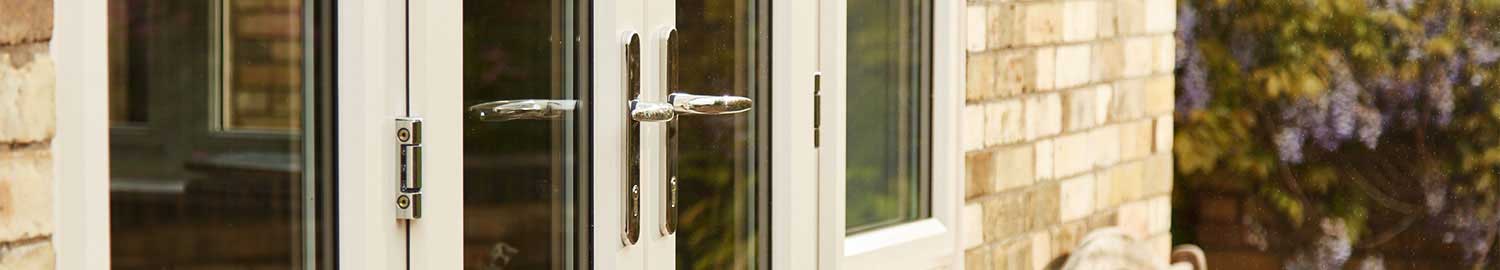 white upvc patio doors with chrome handles