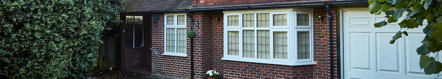 white upvc windows with decorative leaded glass