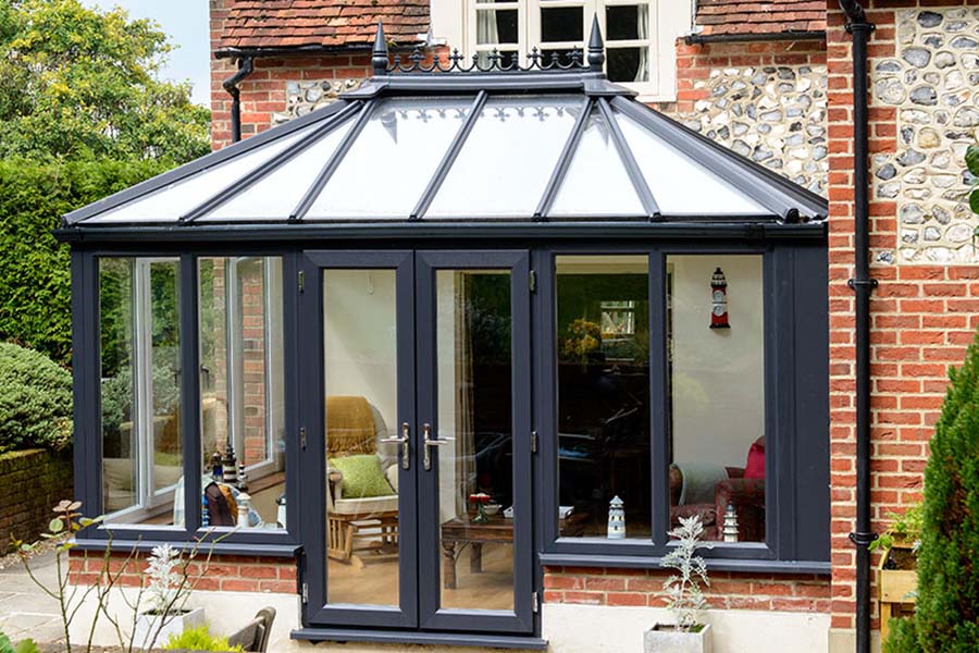 UPVC Elizabethan conservatory in dual Anthracite Grey and White with large uPVC casement windows and French door