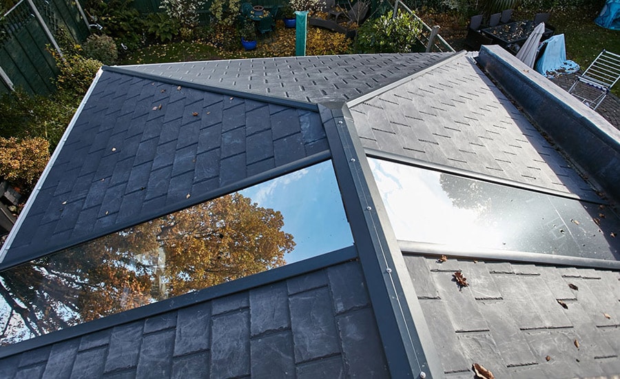 Exterior view of replacement solid roof conservatory with glass panels from Anglian Home Improvements