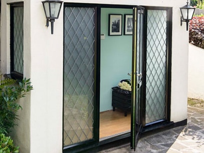 Freshford black aluminium front door with lead bars open Anglian Home Improvements