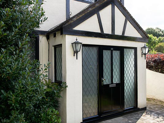 Black coloured aluminium front door Anglian Home Improvements