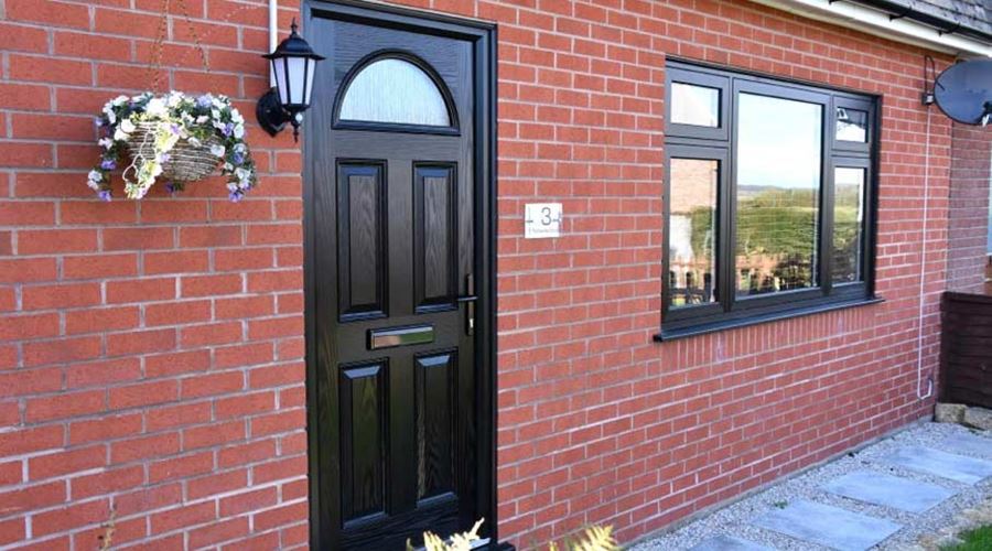 Black coloured composite front door Anglian Home Improvements
