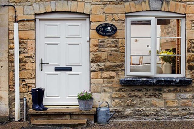 White wooden coloured front door Anglian Home Improvements