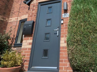 Low angle of Barcelona Anthracite Grey front composite door Anglian Home UK