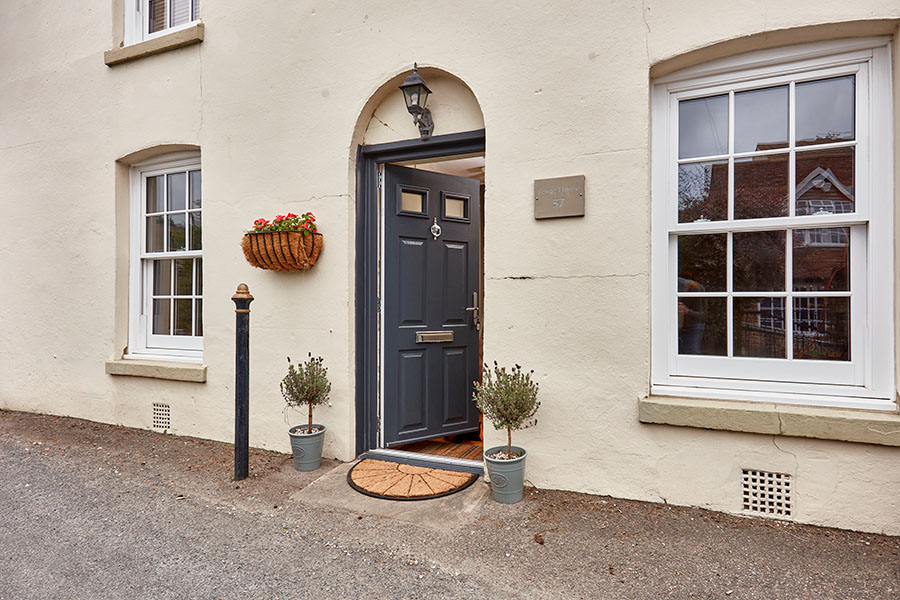 Anthracite grey composite door in pen position with sash windows