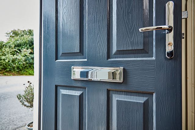 Steel blue elite composite door with pannelled woodgrain finish