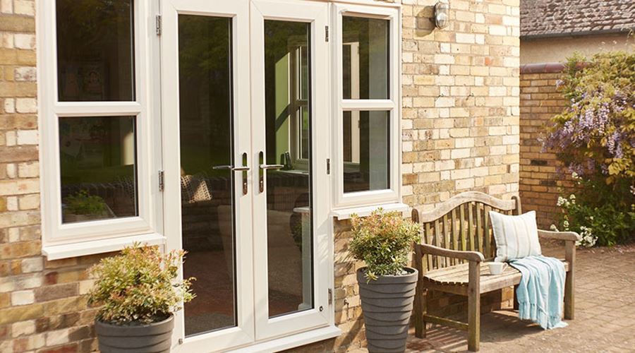 White uPVC French doors with two side windows Anglian Home UK