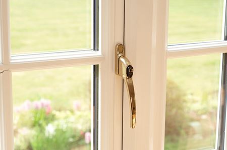 White window interior with Georgian bars and gold handle