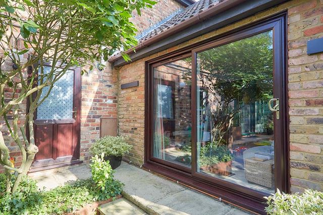 Dark woodgrain uPVC patio door