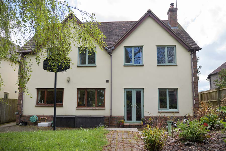 uPVC French doors and casement window in sage green