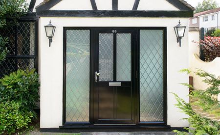 Black aluminium front door with side panels