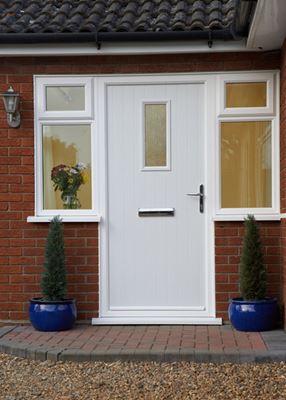 White contemporary composite front door with Cotswold glass and side uPVC casement windows from the Anglian windows and doors range