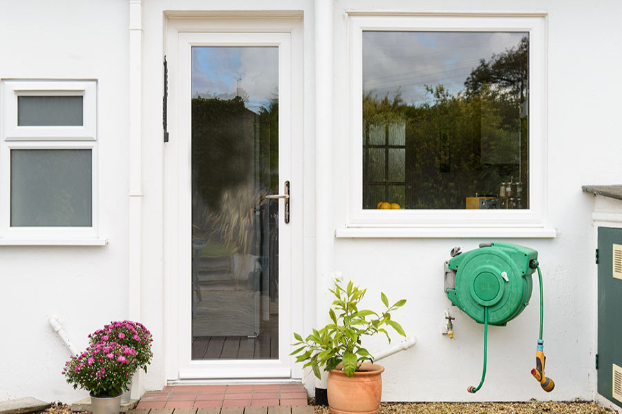 White uPVC fully glazed back door with clear glass and chrome handle from the Anglian back doors range