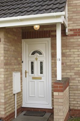 White uPVC traditional front door with bevelled decorative glass and gold handle from the Anglian front door range