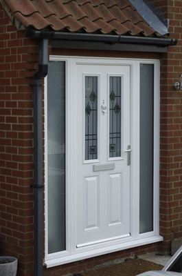 White uPVC front door with fusion decorative glass silver handle and obscure glass side panels from the Anglian uPVC front door range
