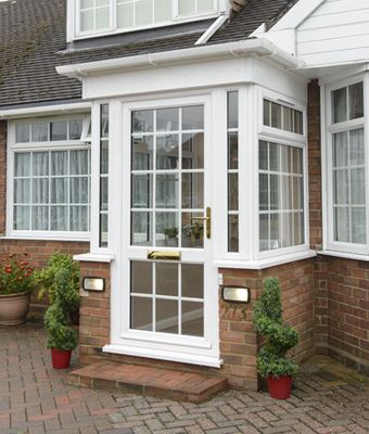 White uPVC front porch with fully glazed uPVC casement windows and cottage bars from the Anglian porch range