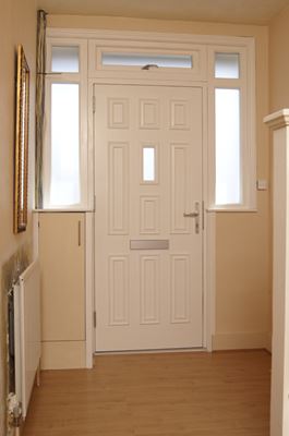 Georgian style wooden front door in white interior view from Anglian Home Improvements