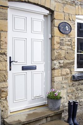 Georgian style traditional wooden front door in white with black handle and letterplate from the Anglian wooden doors range