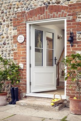 White wooden front door with cottage bars in traditional wide Georgian style with black door handle from the Anglian wooden front doors range