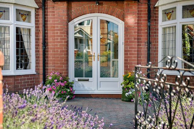 White shaped uPVC front door