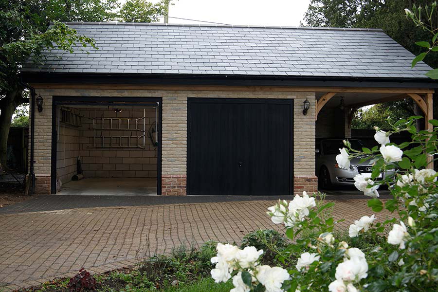 Black woodgrain GRP up and over garage doors