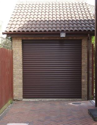 Electric roller garage door in Dark Woodgrain from the Anglian garage door range