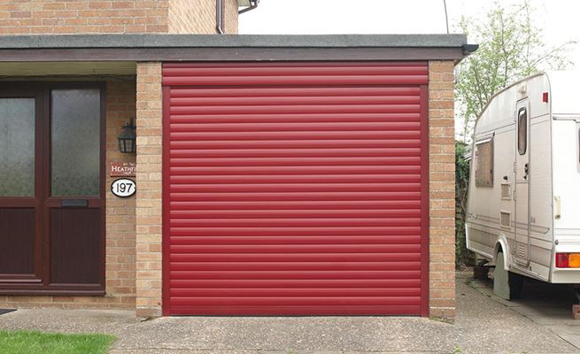 Electric roller garage door in Ruby Red from the Anglian garage door range