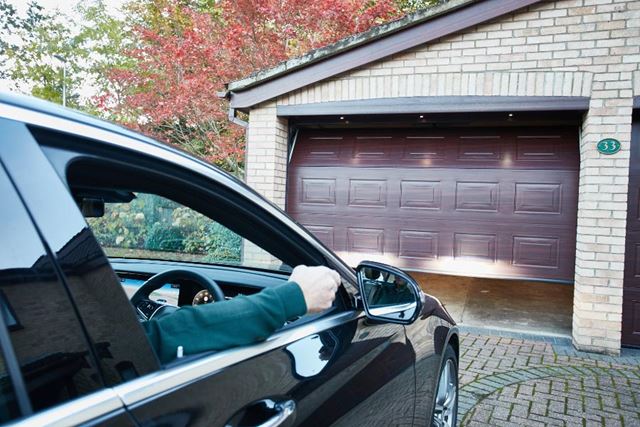 Dark Woodgrain steel sectional garage door from Anglian steel sectional garage door range