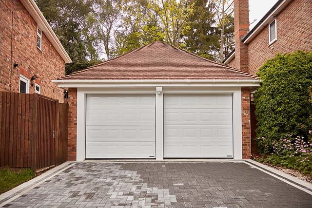 White steel sectional dual garage doors