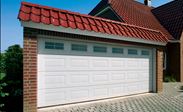 White Georgian style steel sectional garage door with glazed top panels from the Anglian sectional garage doors range