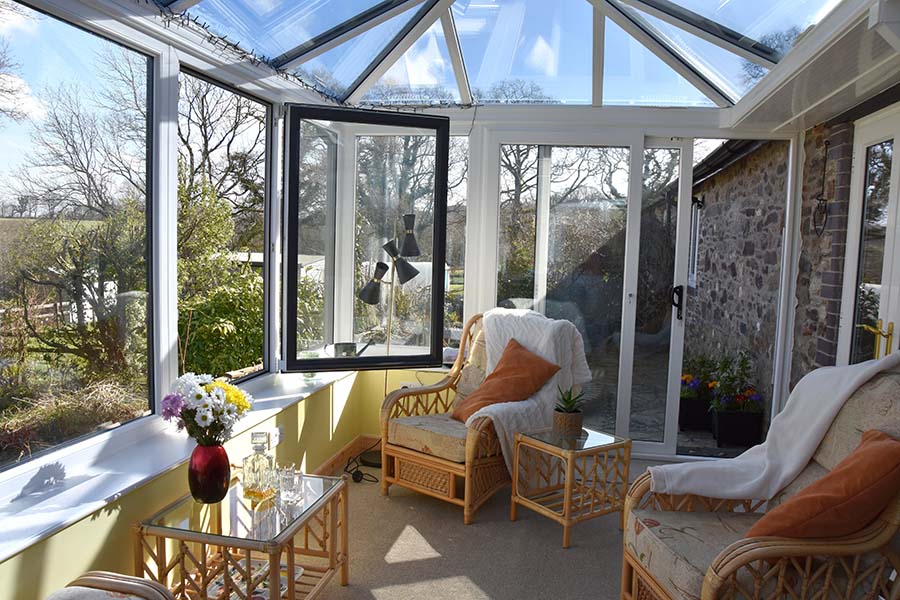 Dual anthracite grey Edwardian conservatory with open window