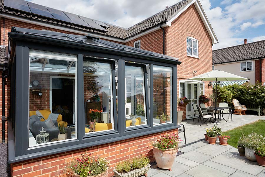 Dual anthracite grey uPVC Edwardian conservatory with tilt and turn windows