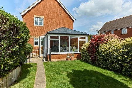 hite Kknight uPVC Edwardian conservatory with replica tiled carbon grey tile roof