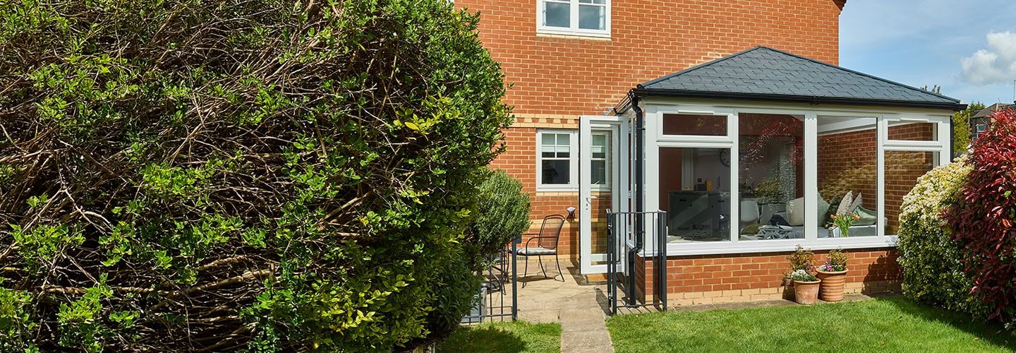 White Knight uPVC Edwardian conservatory with replica carbon grey tiles